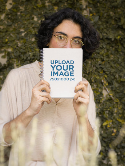Cottagecore-Themed Mockup of a Man Holding a Notebook