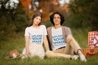 T-Shirt Mockup Featuring a Couple on a Picnic and a Cottagecore Aesthetic