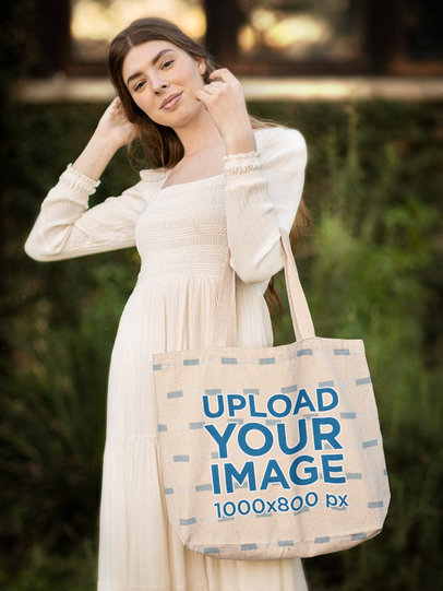 Sublimated Tote Bag Mockup Featuring a Young Woman in a Cottagecore-Styled Outfit