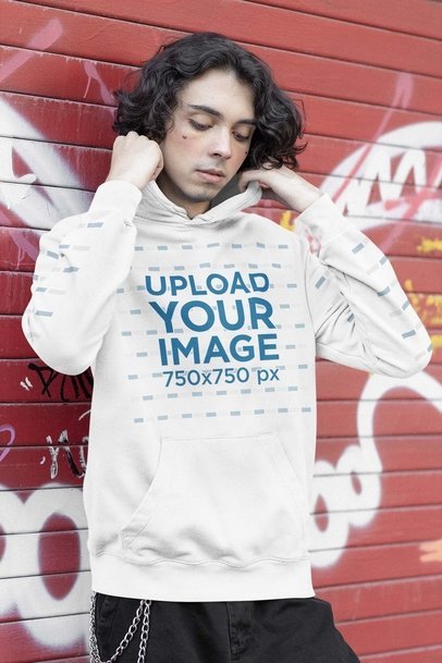 Hoodie Mockup of an E-Guy Posing in Front of a Wall with Graffiti