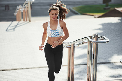 Sports Bra Mockup of a Young Woman Running up a Stairway