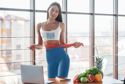 Sports Bra Mockup of a Woman Measuring Her Waist