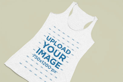Mockup Featuring An Angled Tank Top On a Color Surface 