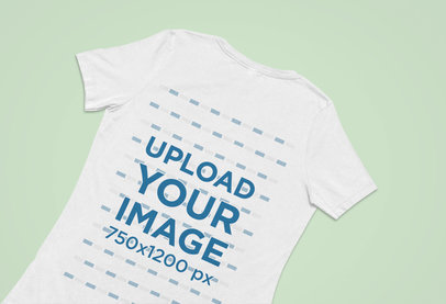 Back-View Mockup of a Bella Canvas T-Shirt Flat Laid over a Surface