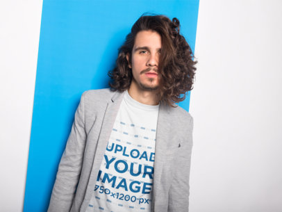 Long Haired Man Wearing a T-Shirt Mockup and a Gray Blazer
