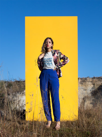 Woman Wearing a Round Neck Tee Mockup Standing Against a Yellow Paper Outdoors
