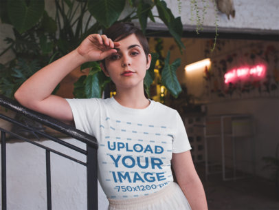 Woman Below a Plant Wearing a Round Neck Tee Template and a Skirt While at an Office