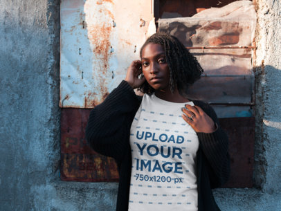 Woman Wearing a Round Neck Tee Mockup While Against a Broken Window