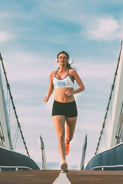 Sublimated Sports Bra Mockup of a Female Runner Wearing Headphones