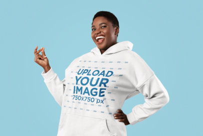 Hoodie Mockup Featuring an Enthusiastic Woman in a Studio