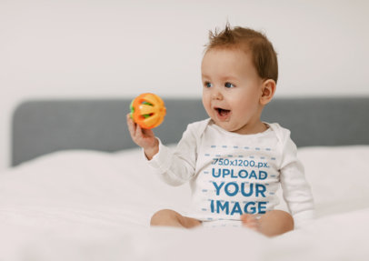 Onesie Mockup Featuring an Adorable Baby Playing with a Toy m19247-r-el2