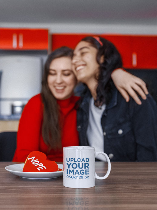 11 oz Coffee Mug Mockup Featuring Two Happy Friends Having an Anti-Valentine's Day Themed Party