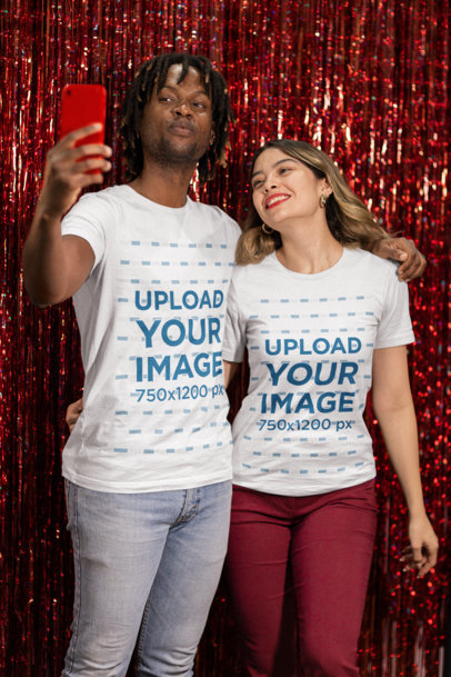 Bella Canvas T-Shirt Mockup of a Couple Taking a Selfie Against a Glittering Backdrop