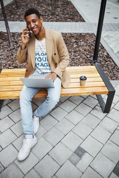 Heathered T-Shirt Mockup Featuring a Happy Man Talking on His Phone