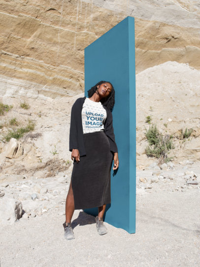 Woman Wearing a Round Neck Tee Template at a Desertic Landscape While Near a Big Block a18560