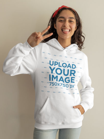 Hoodie Mockup Featuring a Playful Young Woman Making a Funny Gesture m20990