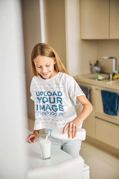 T-Shirt Mockup Featuring a Girl Pouring Milk on a Glass