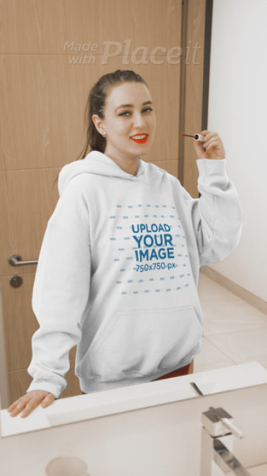 Pullover Hoodie Video of a Woman Putting on Lipgloss in Front of a Mirror