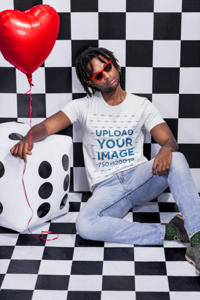 T-Shirt Mockup of a Man with Sunglasses Holding a Valentine's Heart-Shaped Balloon M20973