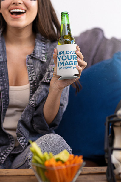 Koozie Mockup of a Happy Woman Holding a Beer While Watching a Football Game