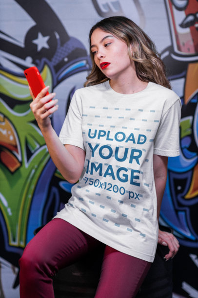 T-Shirt Mockup Featuring a Woman Staring at Her Phone M20979