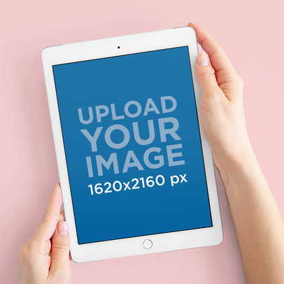 Digital Mockup Featuring Two Hands Holding an iPad over a Colorful Background