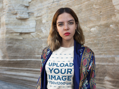 Woman Looking at the Camera Wearing a Tshirt Mockup Outdoors