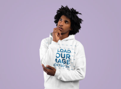 Hoodie Mockup of a Thoughtful Looking Man at a Studio