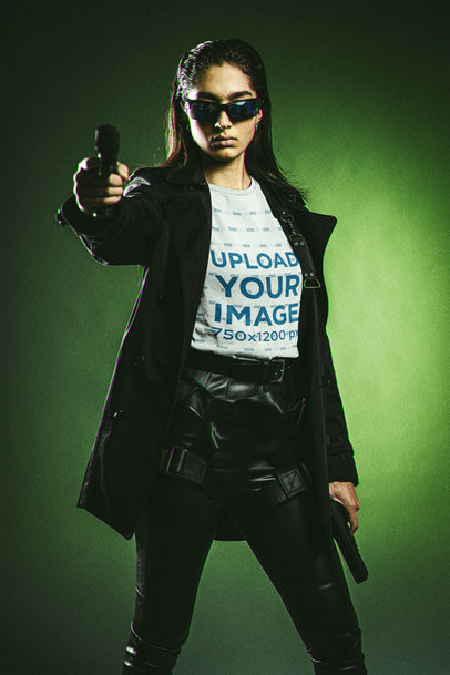 Bella Canvas T-Shirt Mockup Featuring a Serious Woman Pointing a Gun at the Camera m20625