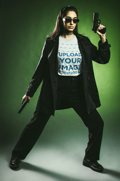 T-Shirt Mockup Featuring a Woman in a Matrix-Inspired Outfit Holding Two Guns m20623