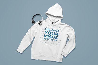 Mockup of a Hoodie Lying Next to a Pair of Headphones m20633-r-el2
