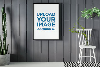 Mockup of a Framed Art Print in a Room with Plants