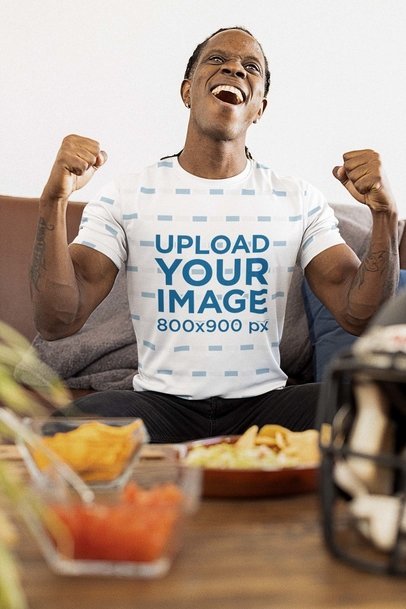 Sublimated Jersey Mockup Featuring a Man Watching the Big Game at Home 