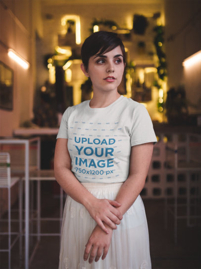 Portrait of a Pretty Woman Wearing a T-Shirt Mockup in a Room with Yellow Lights a18472
