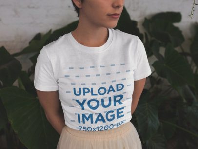 Closeup of a Cropped Face Girl Wearing a T-Shirt Mockup and a Skirt Near Plants a18469