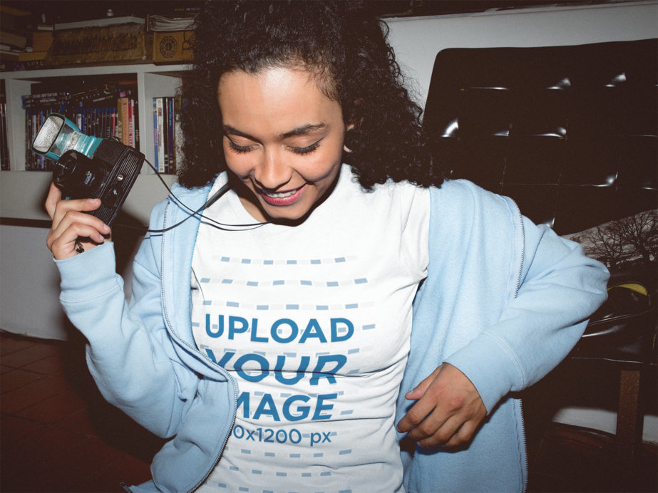 Woman with a Vintage Camera Wearing a T-Shirt Mockup at Night