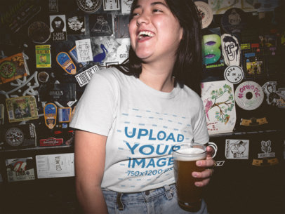 Happy Asian Woman Wearing a Tshirt Mockup in the Bar at Night