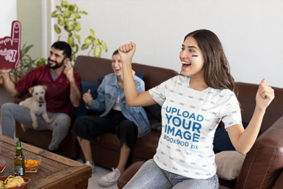 Jersey Mockup of a Female Football Fan Cheering at a Watch Party with Friends