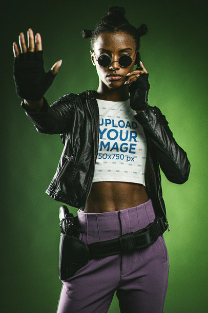 Crop Top Mockup of a Woman in a Matrix-Inspired Outfit with a Hand Raised