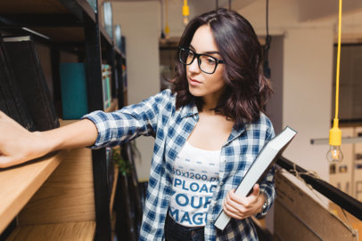 Tank Top Mockup Featuring a Serious Woman Holding a Book and Looking For Something m12472-r-el2
