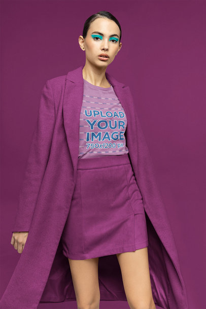 Bella Canvas T-Shirt Mockup Featuring a Woman in a Colorful Studio