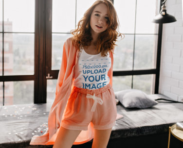 Tank Top Mockup Featuring a Redhead Woman Posing In Front of a Window