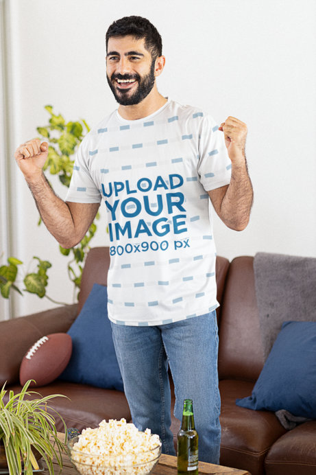 Jersey Mockup of a Football Fan Having Popcorn while Watching The Big Game at Home