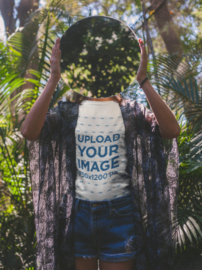 Girl Holding a Mirror on her Face Wearing a T-Shirt Mockup a18461