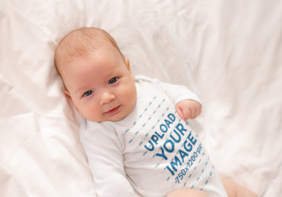 Long-Sleeve Onesie Mockup Featuring a Baby Lying Down