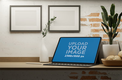 iPad Mockup Placed on a Wooden Desk Featuring Some Plants