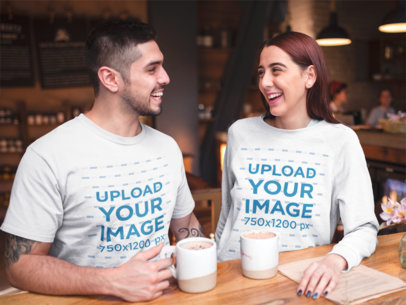 Happy Couple at a Coffee Shop Wearing a T-Shirt and a Crewneck Sweatshirt Mockup on Valentine's Day