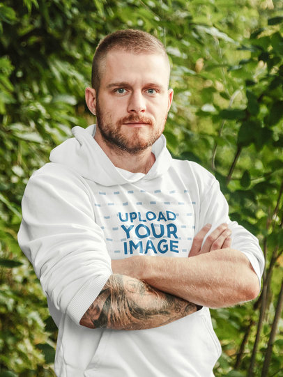 Hoodie Mockup of a Bearded Man With Tattoos in Nature