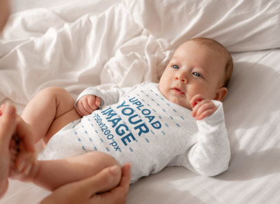 Mockup of Long Sleeve Heathered Onesie Featuring a Baby Boy Looking at His Mom