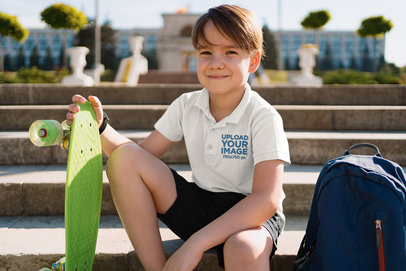 Mockup Featuring a Boy Sitting on Some Stairs While Wearing a Polo Shirt 